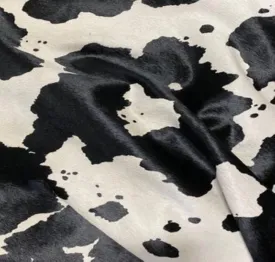 Black Cow Print Stencil Over Off-White Cowhide